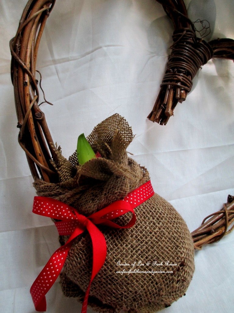 attach the burlap wrapped ball to the wreath with floral wire, then add a ribbon https://lolajack.jp.net/diy-amaryllis-heart-wreath/