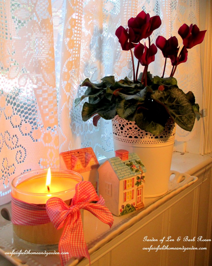 cyclamen, tiny salt & pepper houses and a candle https://lolajack.jp.net/be-my-valentine-valentine-decor/