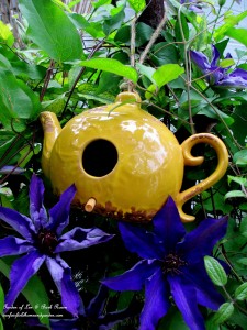 Teapot Birdhouse in the Jackmanii Clematis https://lolajack.jp.net/may-garden-birdhouses-flowers/