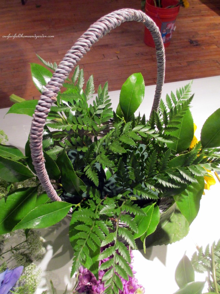 Greens go in first! https://lolajack.jp.net/diy-project-country-flower-basket/