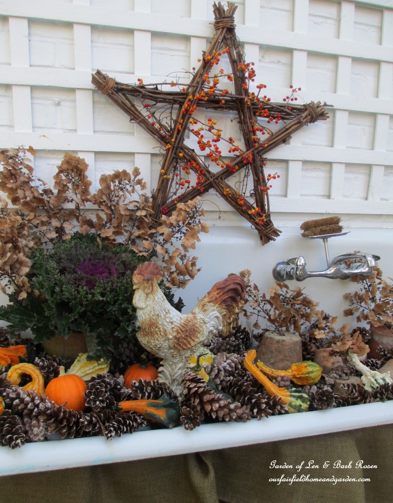 Fall Potting Sink filled with gourds, pinecones, kale and flowerpots. https://lolajack.jp.net/autumn-garden-accents-inside-and-out/