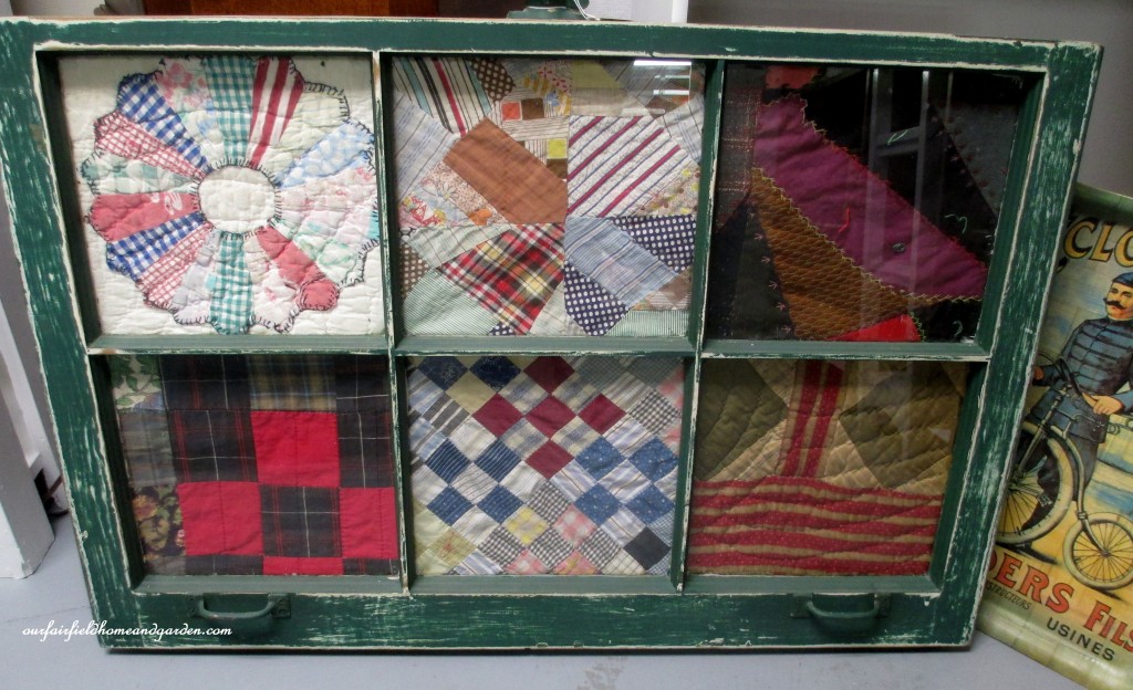 Quilt scraps framed in an old window https://lolajack.jp.net/recycled-window-picture-frame/